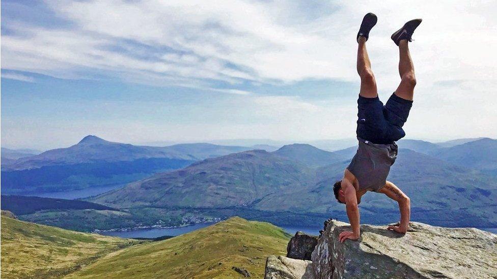 John Trippick admiring the upside down view from The Cobbler after climbing with friends on a gloriously sunny Sunday.