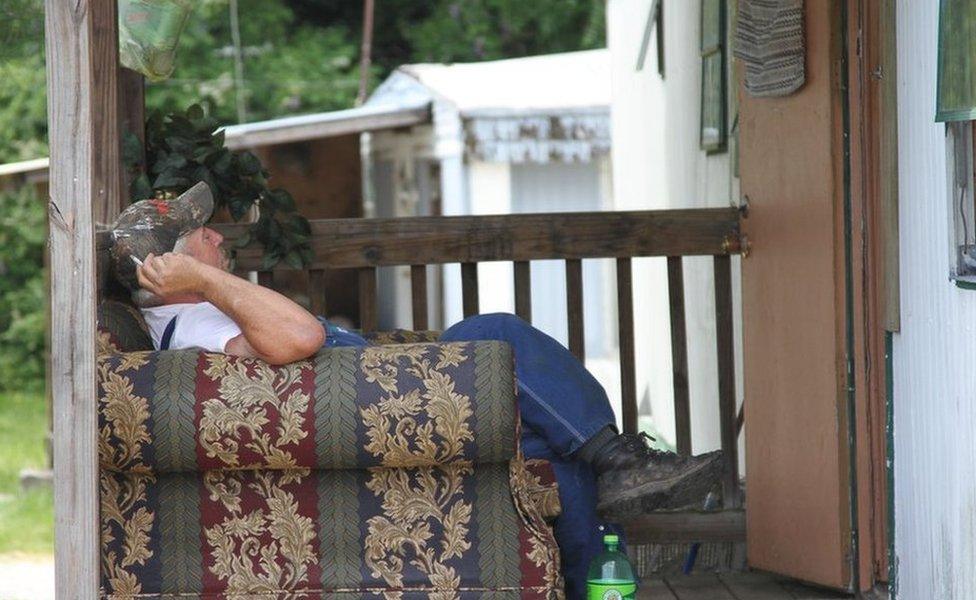 Man outside his trailer home in Jamestown