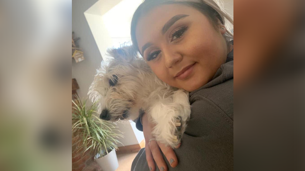 Ella Smith holding a dog