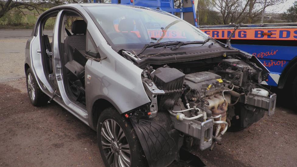 Silver Corsa with bonnet and doors removed