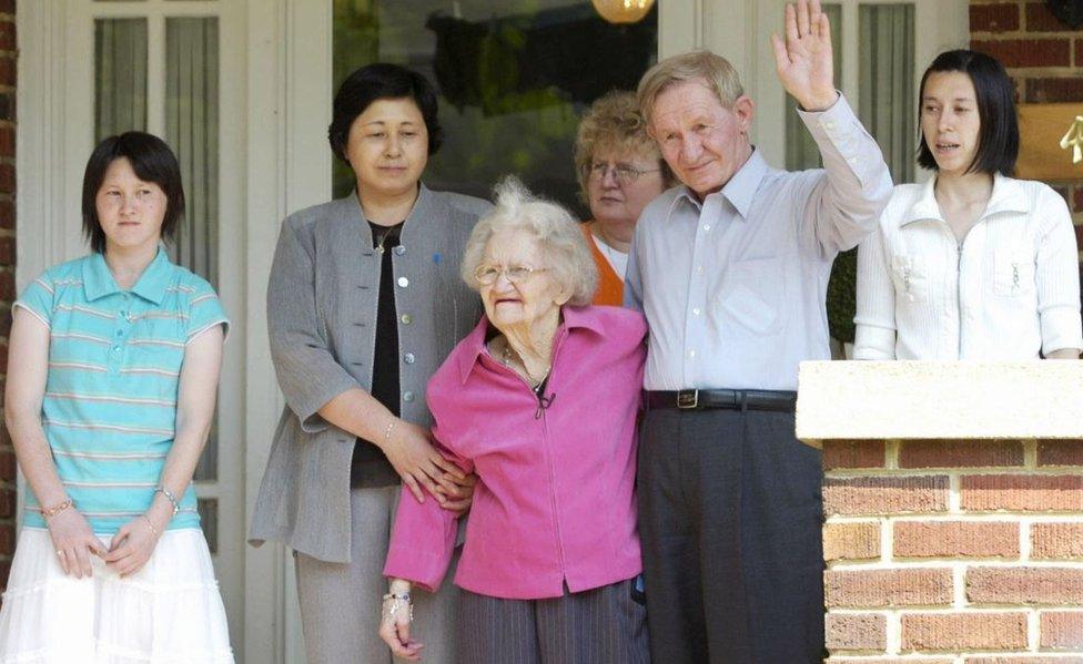 65-year-old Charles Jenkins poses for photos with his mother Pattie Casper, his wife Hitomi Soga, and their daughters Brinda and Mika after his reunion with his 91-year-old mother in Weldon, North Carolina