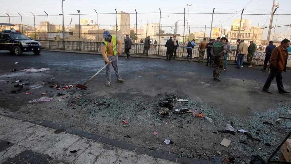 Security forces clear the site of the bombing