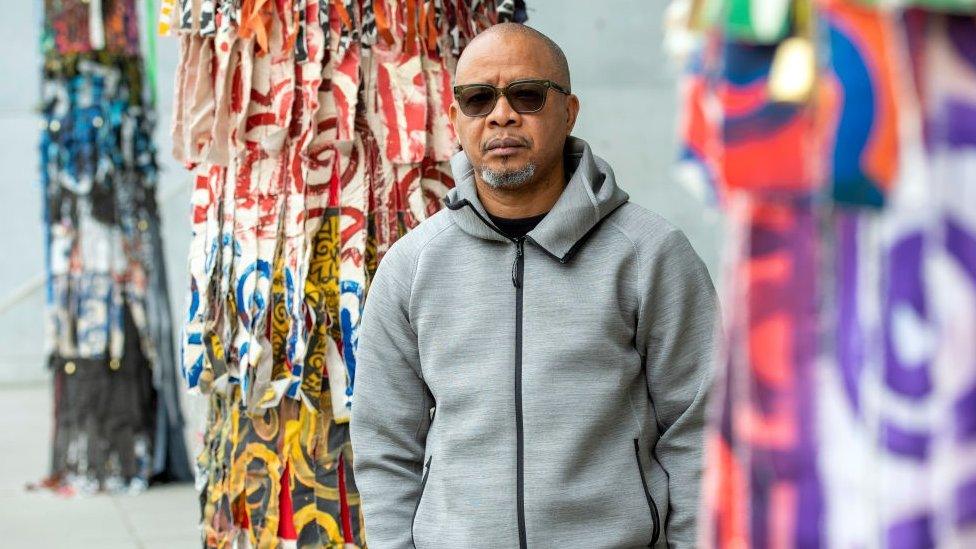 Artist Victor Ehikhamenor from Nigeria in front of his artwork at the Pinakothek der Moderne on May 21, 2021