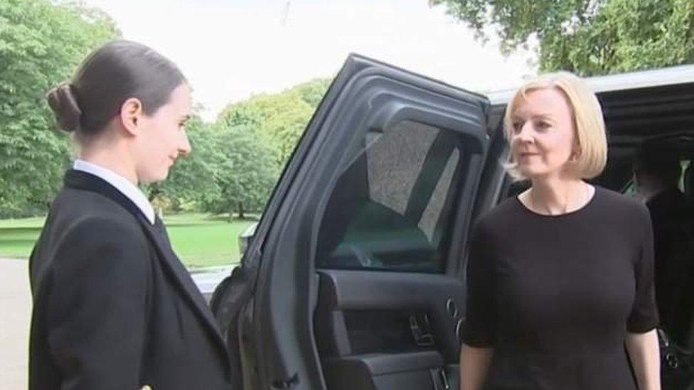 liz-truss-standing-outside-car.