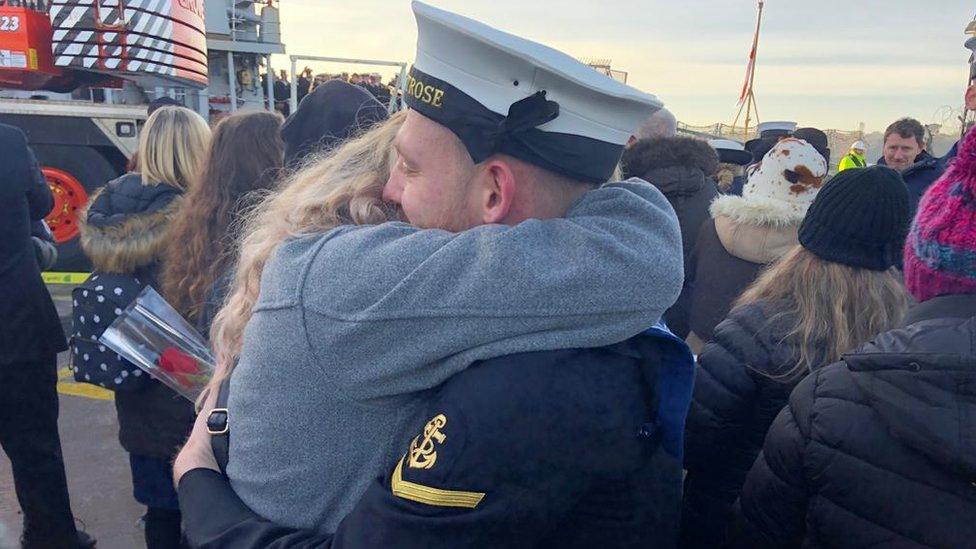 Families in Devonport at the homecoming of HMS Montrose