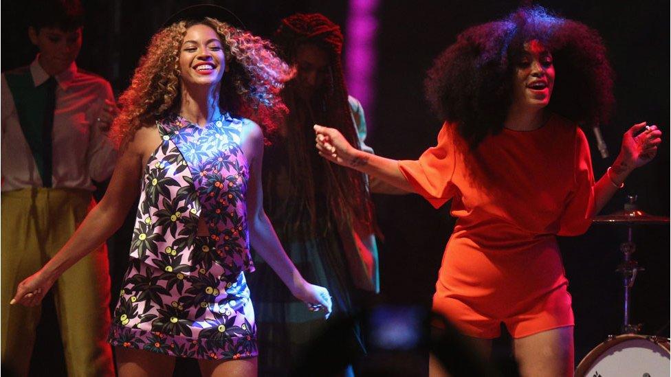 Beyonce and Solange on stage