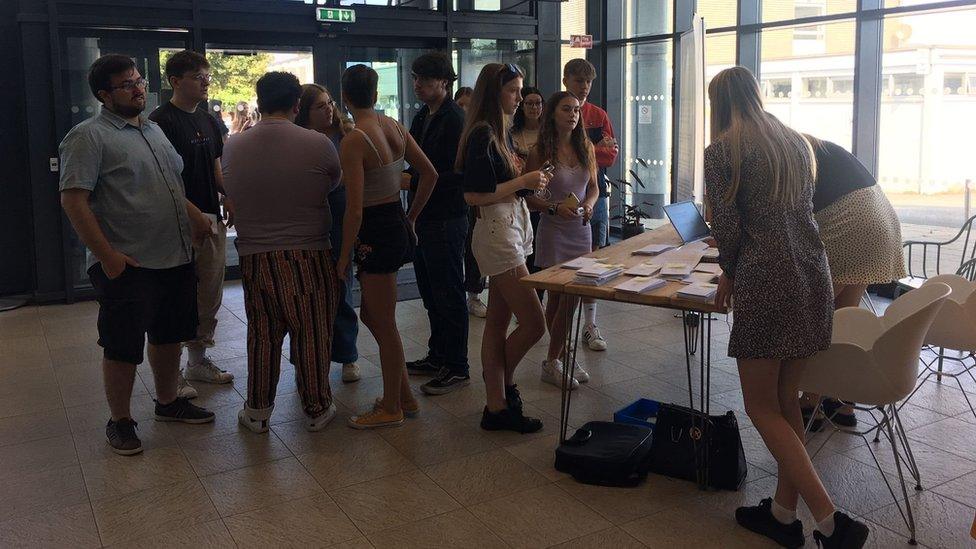 students collecting exam results