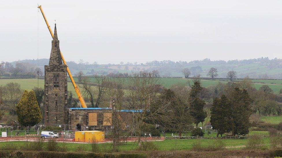 Crane in place outside church