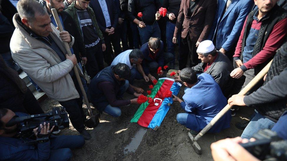 People attend the funeral of seven-year-old Aysu Iskenderova who was killed on 27 October allegedly by Armenian shelling, in the village of Garayusifli near Barda, Azerbaijan, 28 October 2020. Armed clashes erupted on 27 September 2020 in the simmering territorial conflict between Azerbaijan and Armenia over the Nagorno-Karabakh territory along the contact line of the self-proclaimed Nagorno-Karabakh Republic