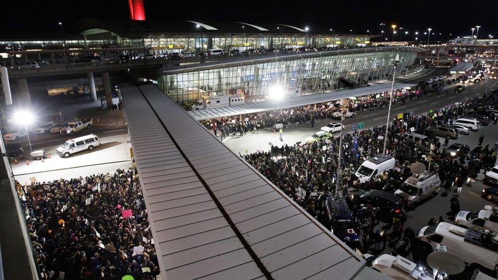 People gather for a protest at Terminal 4 of the John F. Kennedy (JFK) International Airport after people arriving from Muslim countries were held at the border control as a result of the new immigration policies enacted by US President Donald Trump in New York, New York, USA, 28 January 2017.