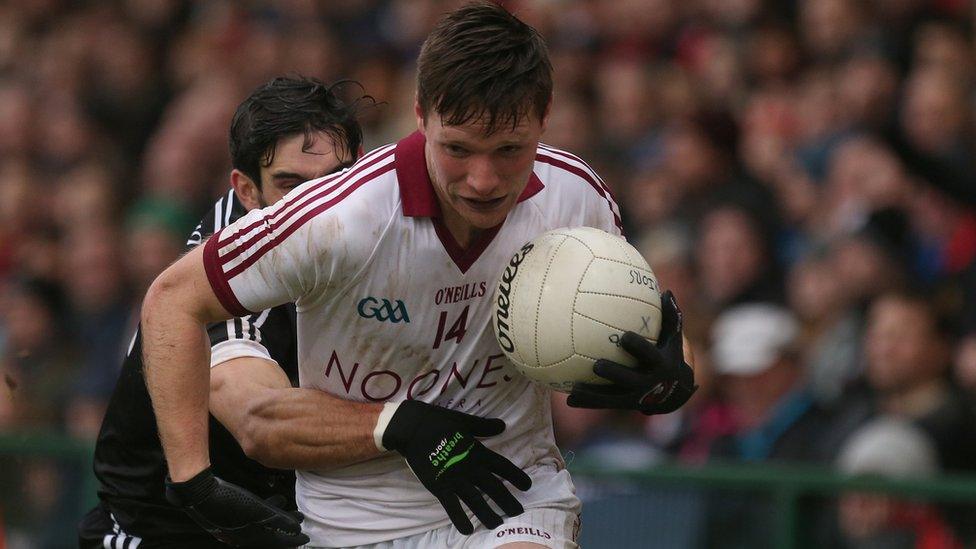 Kilcoo defender Niall Branagan challenges Slaughtneil's Se McGuigan during the big match at the Athletic Grounds