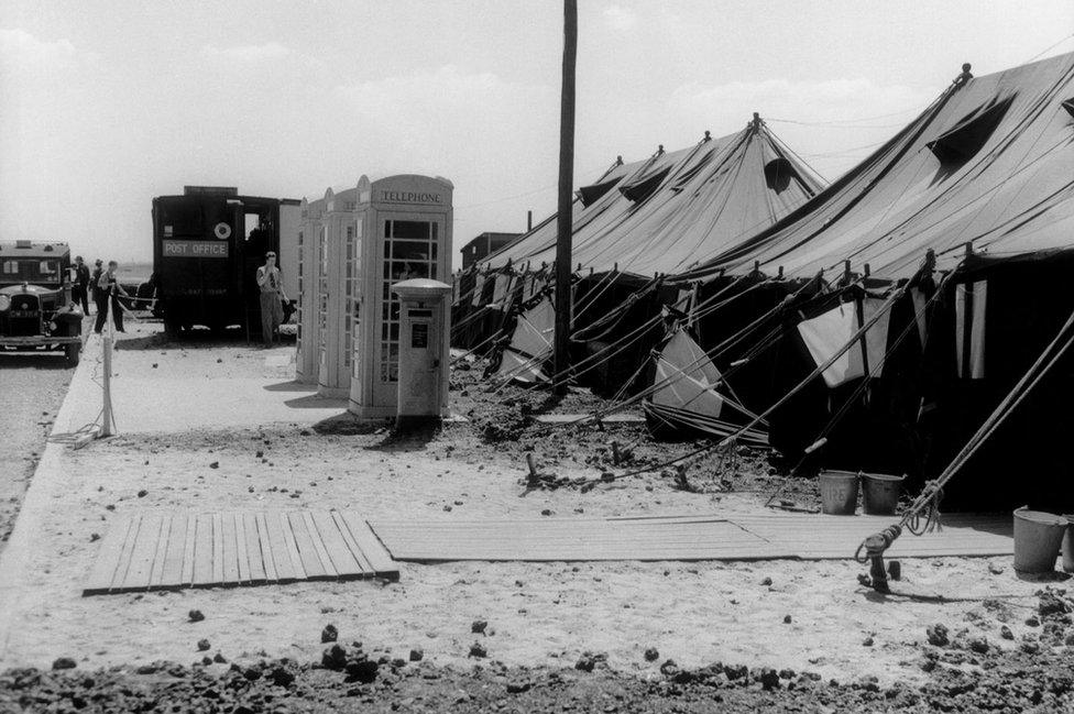 London Airport (later to be renamed Heathrow), brown, ex-military marquees serving as arrivals and departures lounges, 1946.