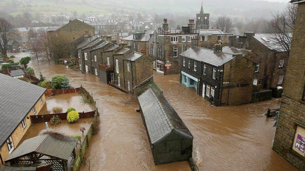 The River Calder bursts its banks in the Calder Valley town of Mytholmroyd on 26 December 2015