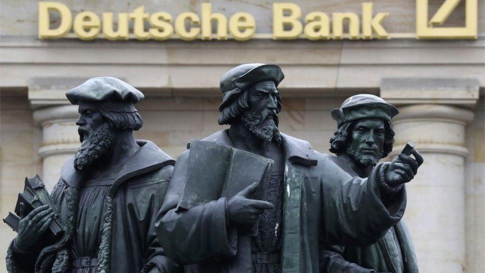 Statue in front of a Deutsche bank