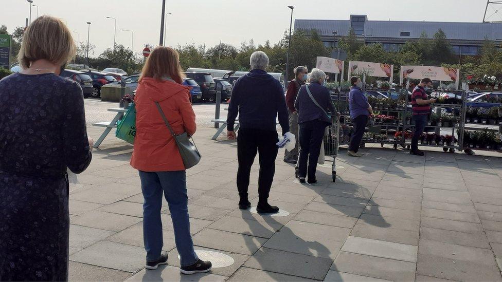 Queue outside supermarket during lockdown