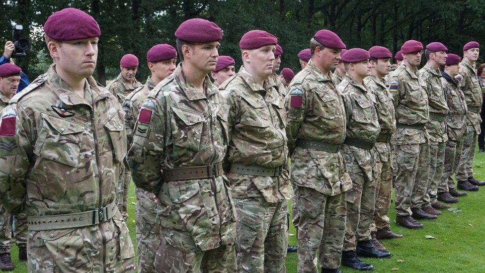 Members of the military attending the service