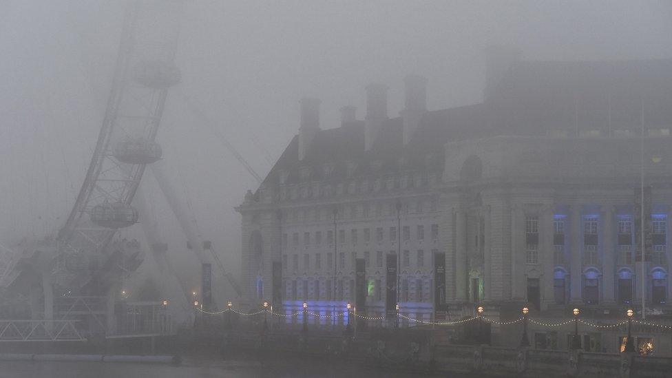 London Eye in thick fog