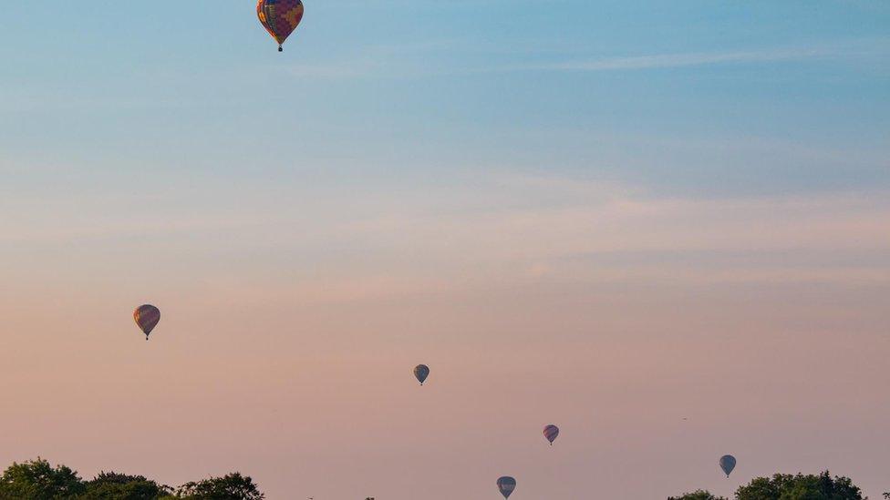 The balloons were a beautiful sight as the sun went down