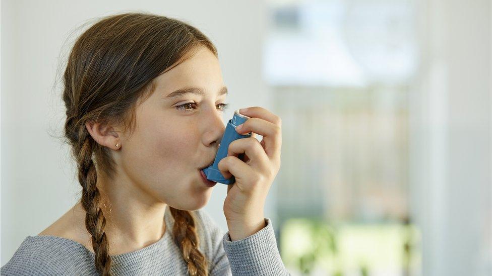 Girl-using-asthma-inhaler.