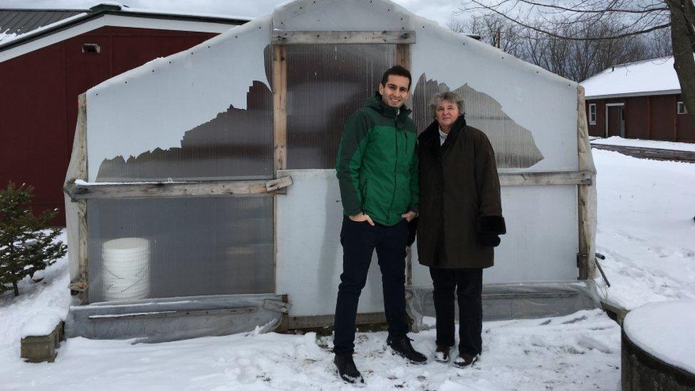 Margaret Skinner and Arash Ghalehgolabbehbahani stand next to one of their saffron pilot patches in Burlington, Vermont.