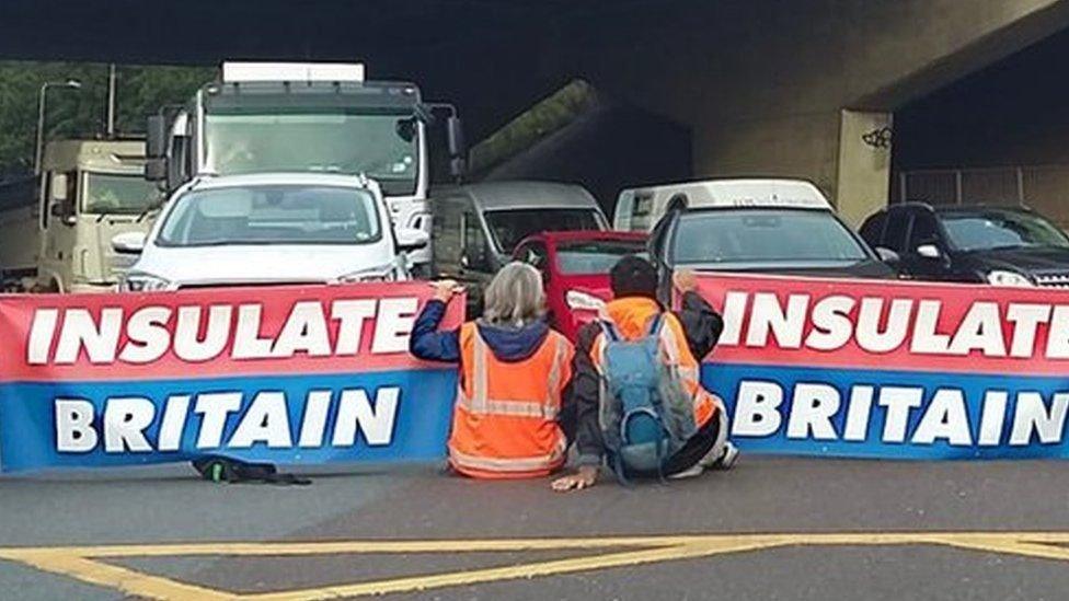 Insulate Britain activists blocking the highway during a protest