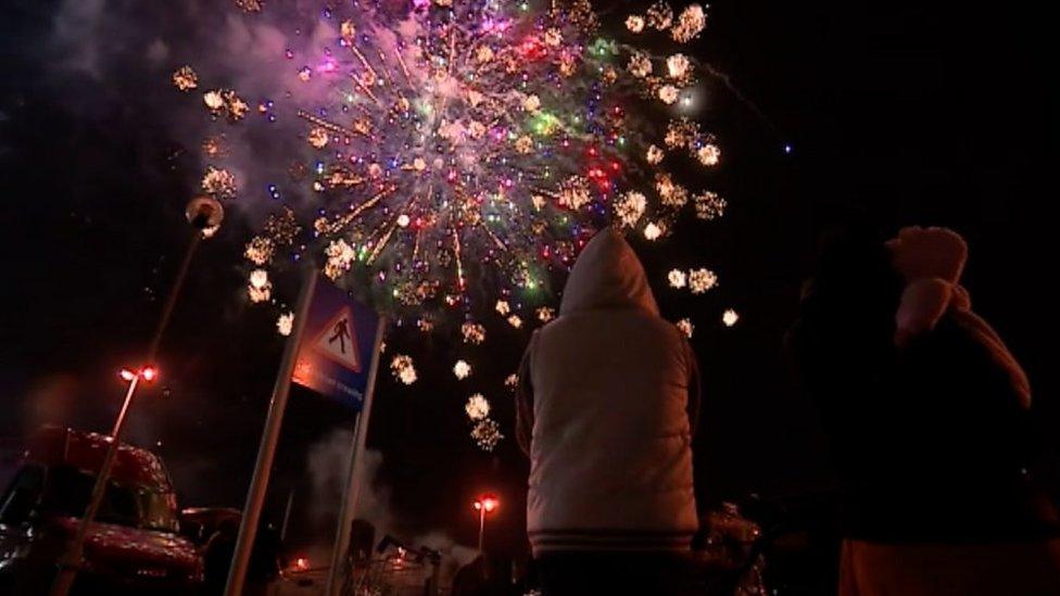 Children watching firework display