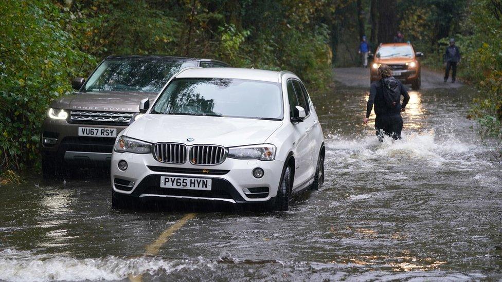 A broken down car in floodwater near Derwentwater