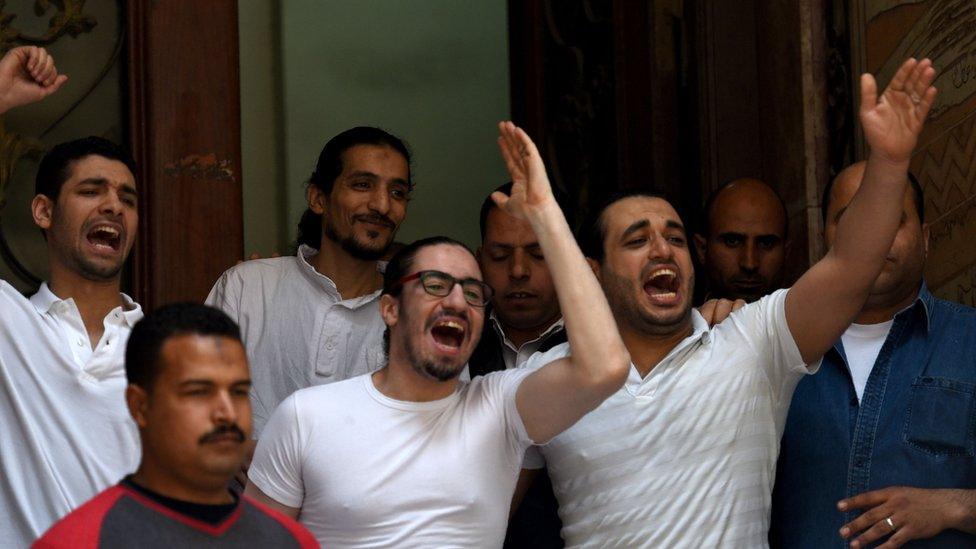 Mohamed Hassanein (white shirt on right), Aya Hijazi's husband, and colleagues celebrated her acquittal