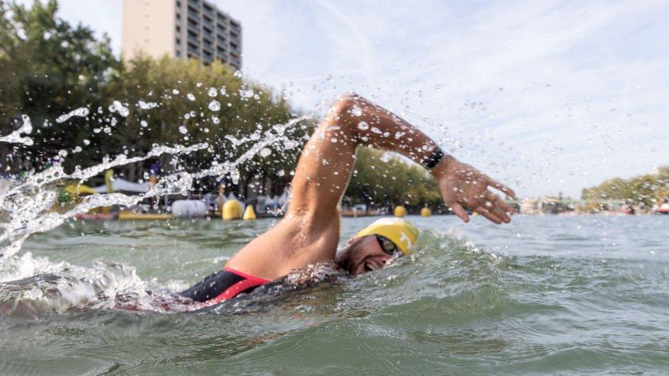 Swimmer in the canal de l'Ourcq, Paris