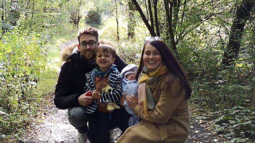 Sara, Andrew and their two children Ezra and Eliza in woodland path