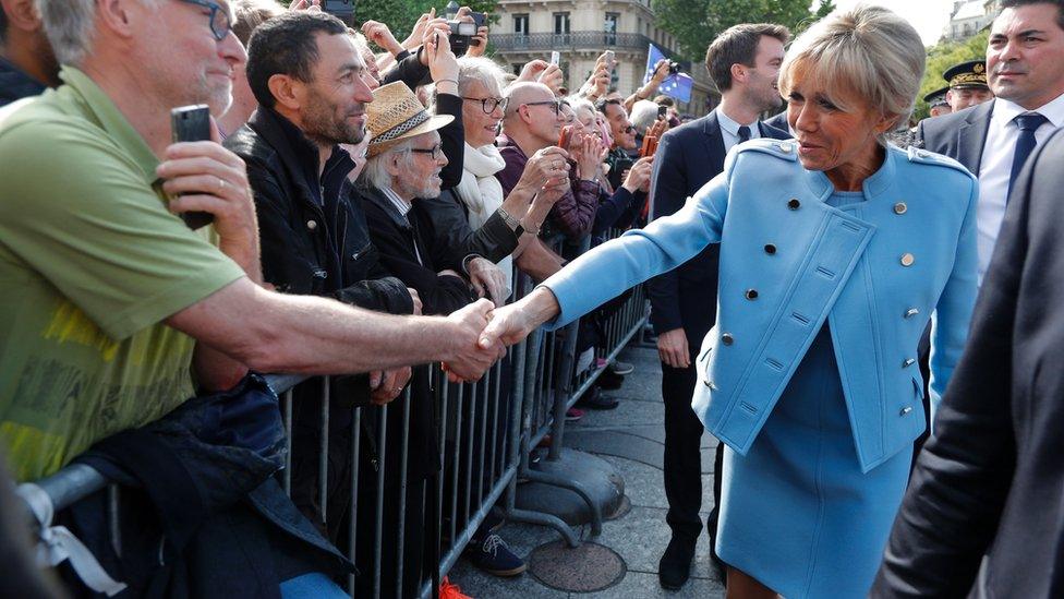 Brigitte Trogneux, wife of French President Emmanuel Macron, greets the crowd outside the City Hall on May 14, 2017 in Paris