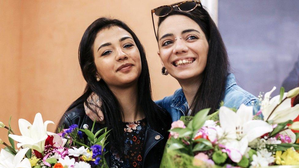 Spaniard Maria Jimena Rico and her Egyptian girlfriend Shaza Ismail pose for photographers as they attend a press conference at the city hall of Torrox, near Malaga, southern Spain, 02 May 2017