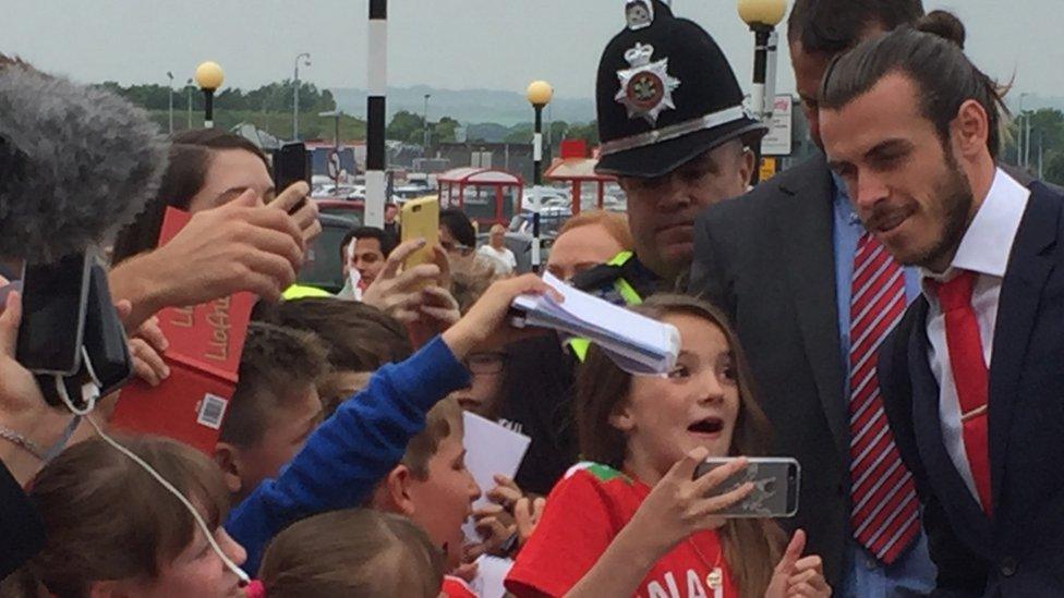 Gareth Bale stopped for a selfie with a fan as he arrived at the airport