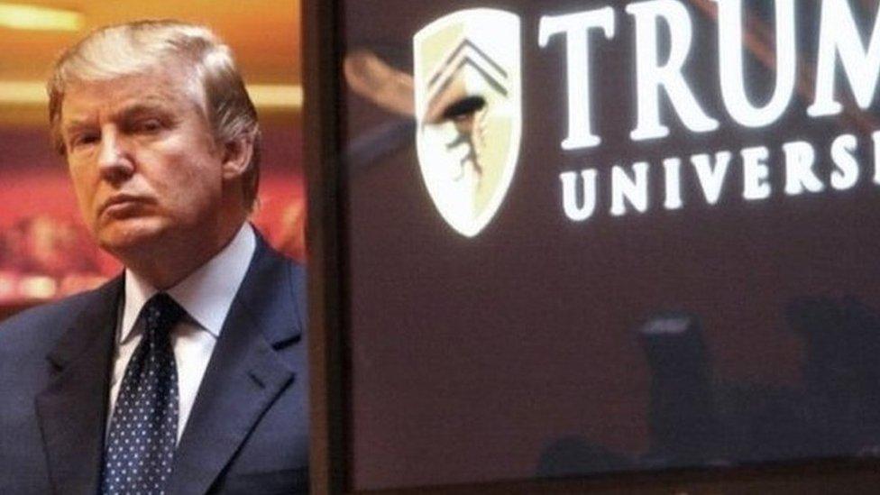 Donald Trump listens as Michael Sexton speaks at the launch of the Trump University investment school in 2005