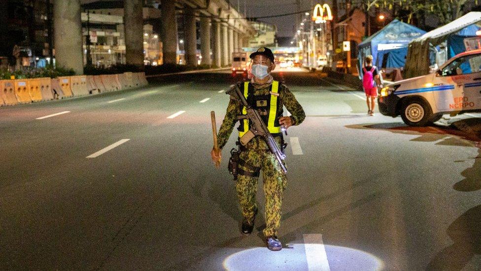 A police officer patrols in the Philippines