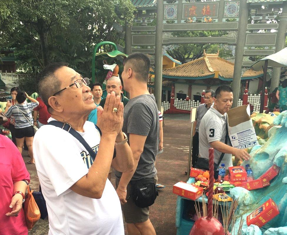 A worshipper at Singapore's Haw Par Villa