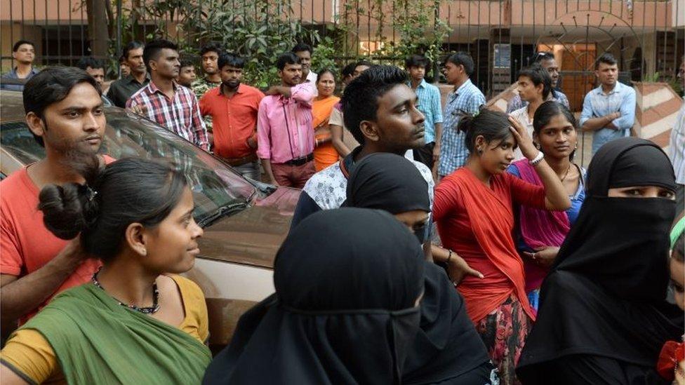 People gather outside the residence of Bollywood actress Sridevi Kapoor in Mumbai on February 26, 2018, following her death.