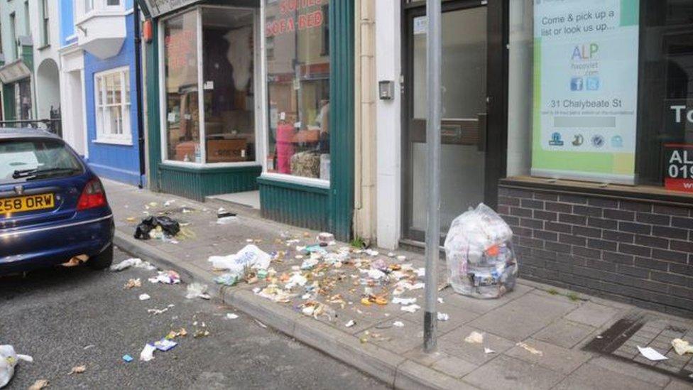 Strewn rubbish on a street in Aberystwyth