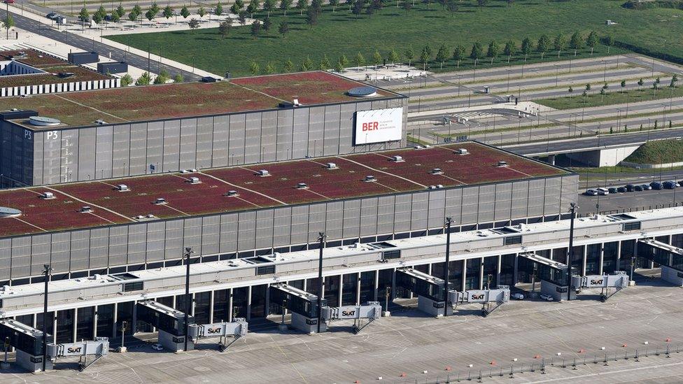 An aerial view shows the unfinished BER Willy Brandt Berlin Brandenburg International Airport in Schoenefeld, eastern Germany