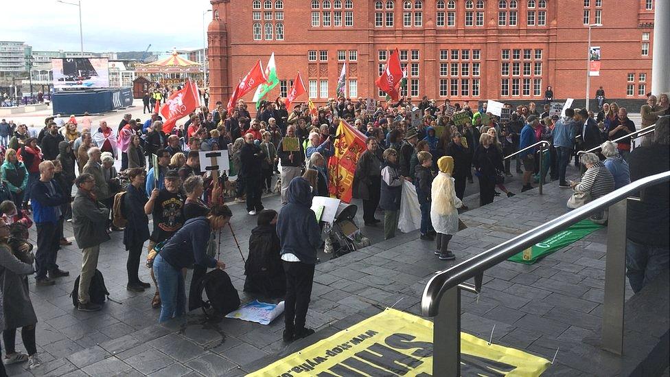 Protesters on the steps of the Senedd in Cardiff Bay