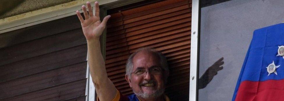 Antonio Ledezma waves from a window of his residence in Caracas, Venezuela, 16 July 2017