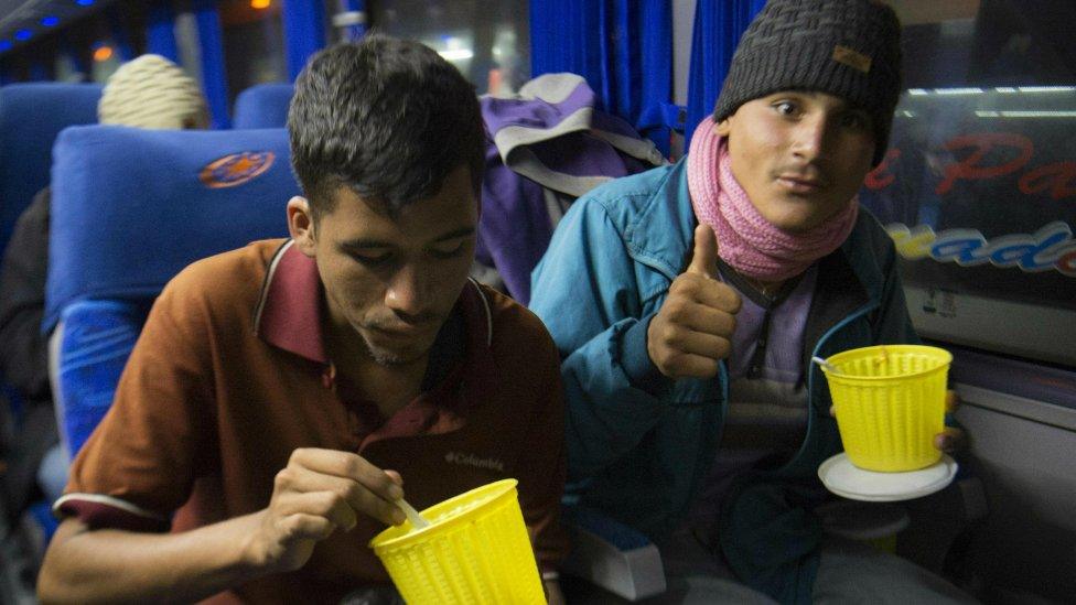 Venezuelan nationals travel by bus in southern Ecuador towards the border with Peru on August 24, 2018