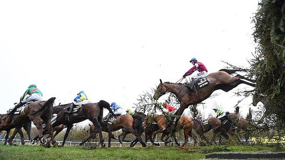 David Mullins riding Rule The World clears a jump on the way to winning the Crabbie's Grand National steeplechase at Aintree Racecourse on April 9, 2016