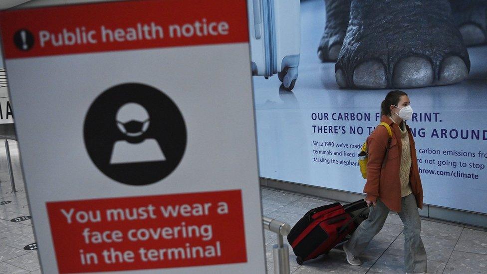 Passenger and sign at Heathrow