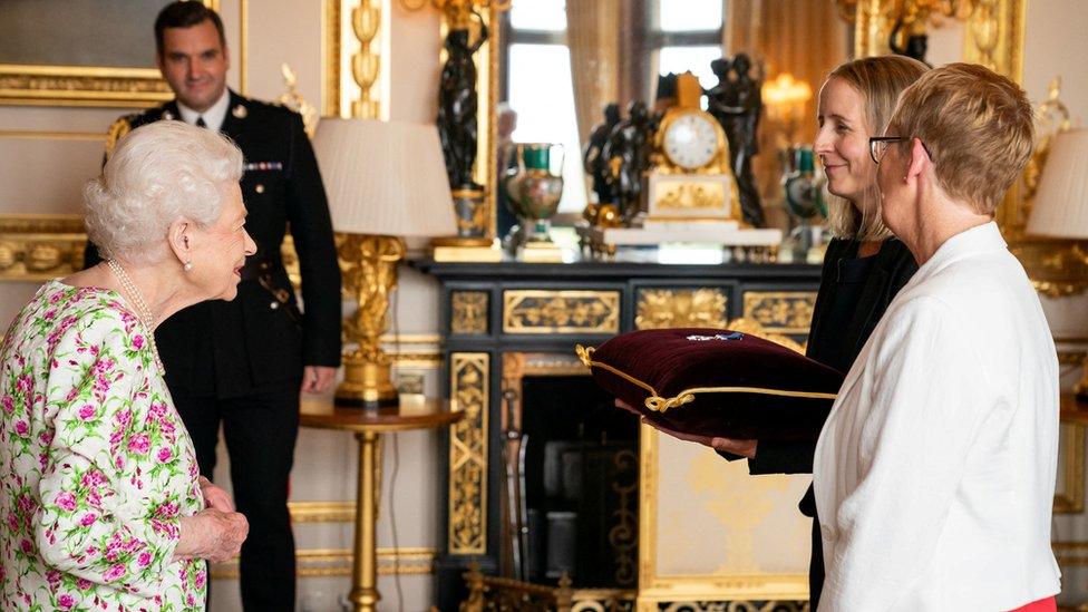 The Queen awarding the George Cross to Judith Paget CBE, chief executive of NHS Wales, and Dr. Ami Jones MBE