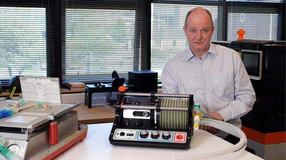 Co-inventor Dr John Dingley with the ventilator attached to a mechanical lung