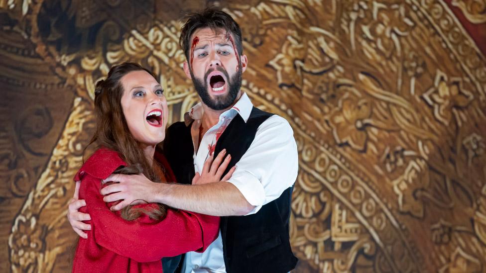 Sinead Campbell-Wallace as Floria Tosca and Adam Smith as Matio Scarpia perform onstage during a production of Tosca by Giacmo Puccini at London Coliseum on September 28, 2022 in London, England.