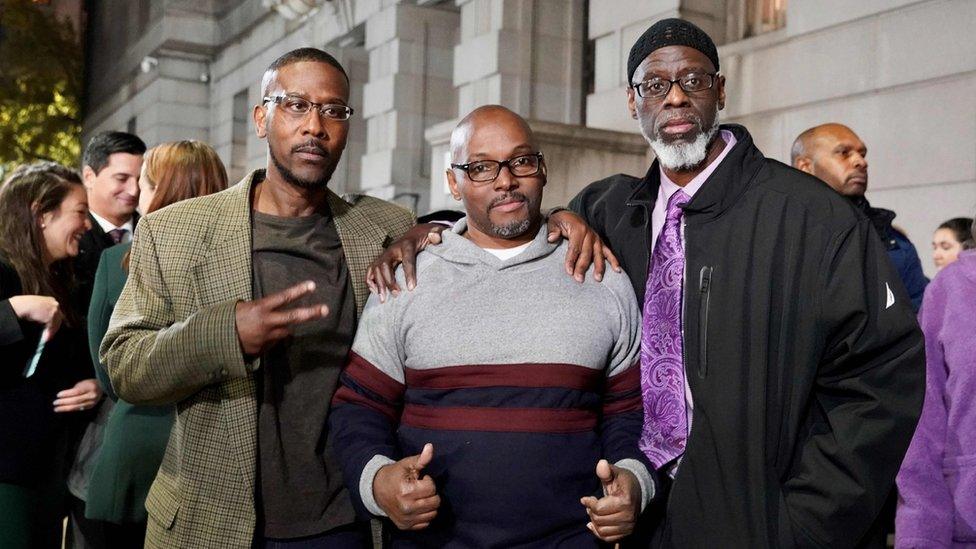 The three men pictured following their release