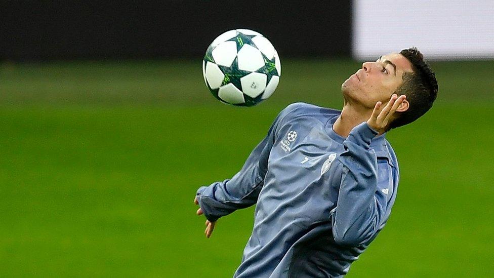 Real Madrid's Cristiano Ronaldo jumps for the ball during a training session prior the Champions League Group F soccer match between Borusia Dortmund and Real Madrid at the stadium in Dortmund, Germany, Monday, Sept. 26, 2016.