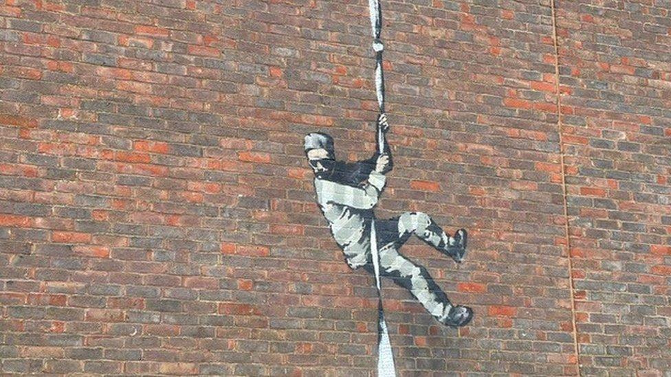 Banksy artwork on wall of Reading Prison